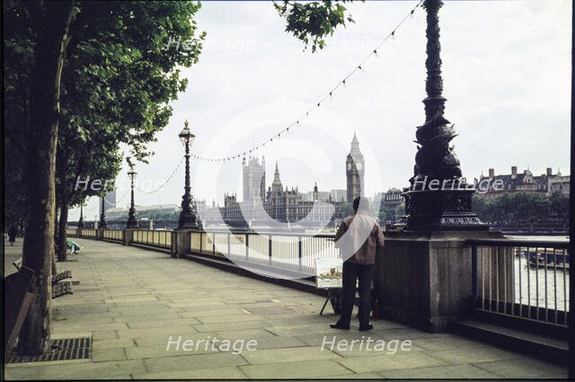 A man on the promenade on the south bank of the Thames near Hungerford Bridge...London, 1983. Creator: Dorothy Chapman.