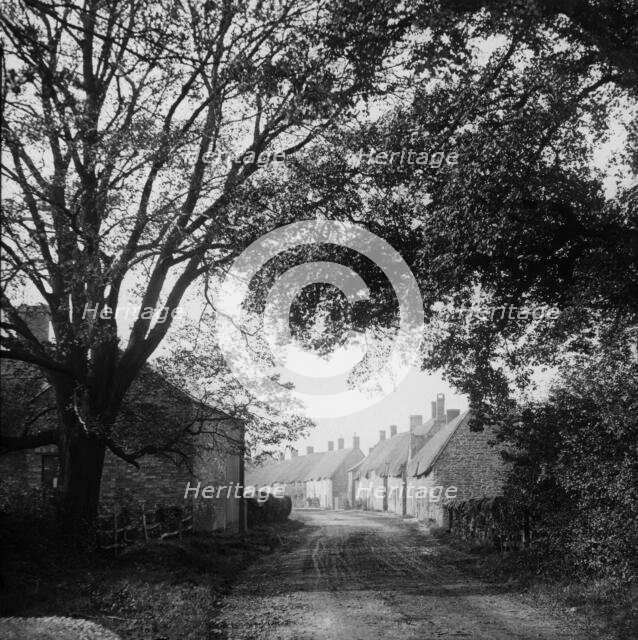 Village Road, possibly Ireland, c1890s. Creator: Robert Augustus Henry L'Estrange.