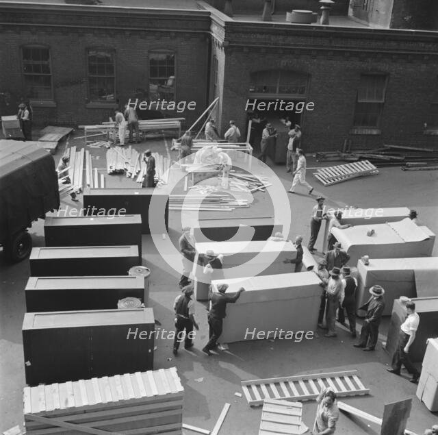 Possibly: United States government workers and carpenters making crates..., Washington, D.C., 1942. Creator: Gordon Parks.
