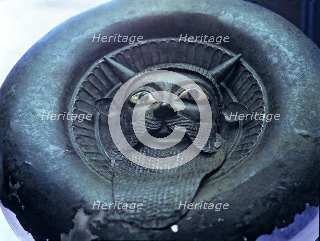 Mask of a river divinity, in bronze.