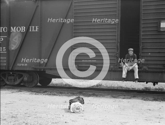 Car on siding across tracks from pea packing plant, Calipatria, Imperial Valley, 1939. Creator: Dorothea Lange.