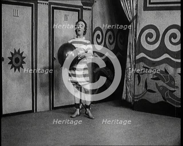 Stanley Lupino Performing in a Show in London Wearing a Stripy Bathing Suit, 1922. Creator: British Pathe Ltd.