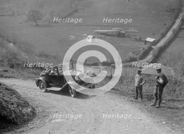 Kitty Brunell driving a 1930 2-seater Ford Model A, 1931.   Artist: Bill Brunell.