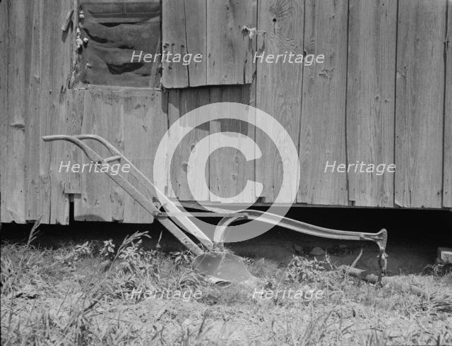 Sharecropper's cabin and sharecropper's tool, Mississippi, 1937. Creator: Dorothea Lange.