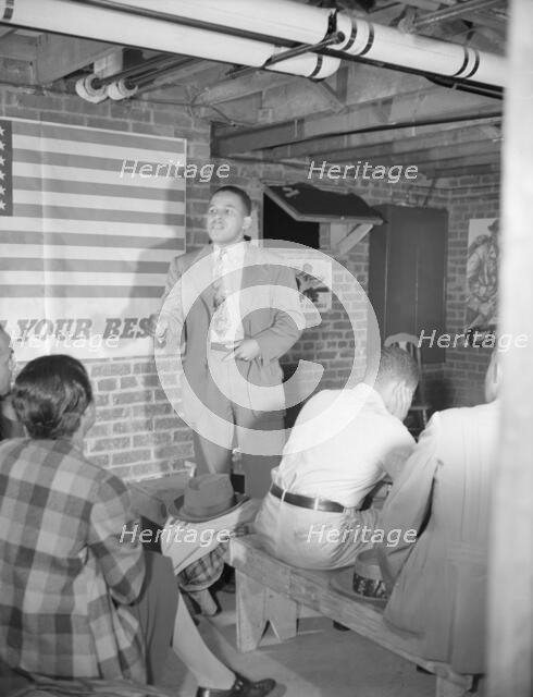 Air raid wardens' meeting in zone nine, Southwest area, Washington, D.C, 1942. Creator: Gordon Parks.