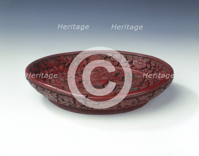 Carved red lacquer saucer with dragon amid clouds, Ming dynasty, China, late 16th century. Artist: Unknown