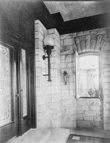 Entrance with etched glass door at left, sconce, and open window..., Greenwich, Connecticut, 1908. Creator: Frances Benjamin Johnston.