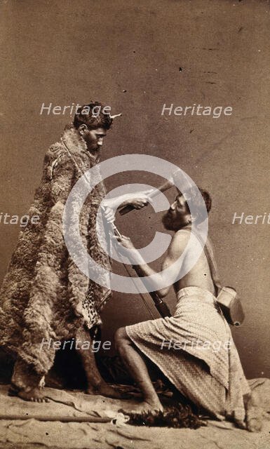 Two Maori men, simulating armed attack with a hatchet and a spear(?), c1880s. Creator: Unknown.