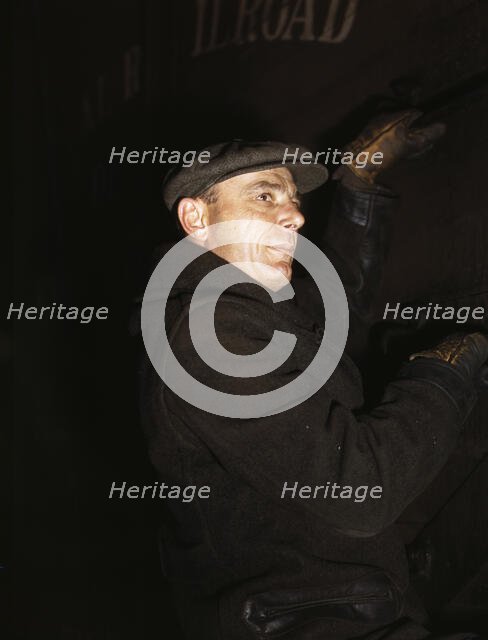 Frederick Batt, brakeman, on the C & NW RR, at Proviso yard, Chicago, Ill., 1942. Creator: Jack Delano.