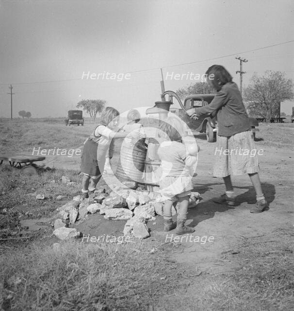 Water supply, Migratory camp for cotton pickers, San Joaquin Valley, California, 1936. Creator: Dorothea Lange.