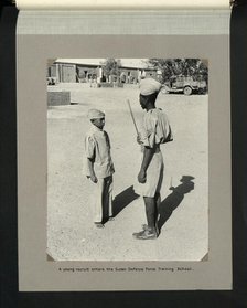 A young recruit enters the Sudan Defence Force Training School, 1964. Creators: Colonial Office, Unknown.