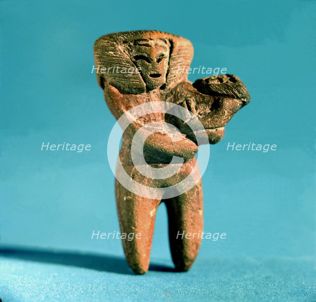 Female Figure with a newborn in arms, from a rubbish dump excavated near the town of Valdivia. Th…