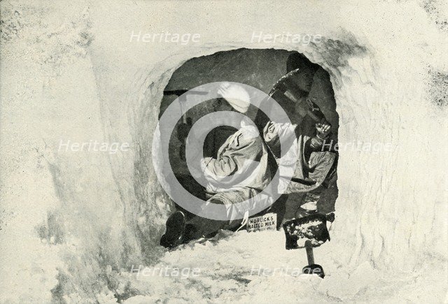 'Lieut. Evans and Nelson Cutting a Cave for Cold Storage', 12 January 1911, (1913). Artist: Herbert Ponting.