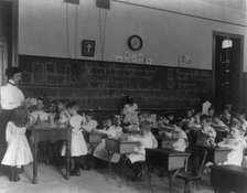 Small children studying geometry in a classroom in Washington, D.C., (1899?). Creator: Frances Benjamin Johnston.