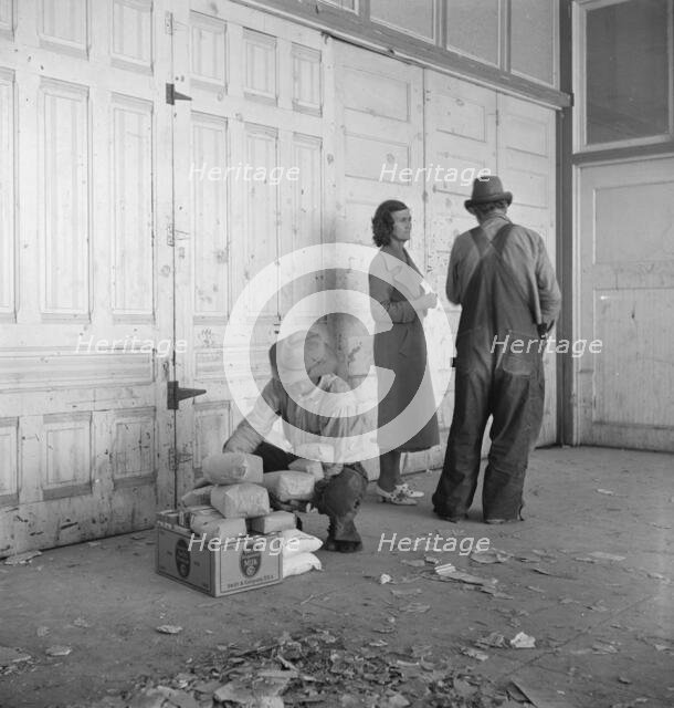 Outside the FSA grant office during pea harvest, Calipatria, California, 1939. Creator: Dorothea Lange.