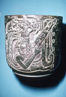 Mayan Pot of Man in high animal head-dress holding staff with lotus flower. Artist: Unknown.