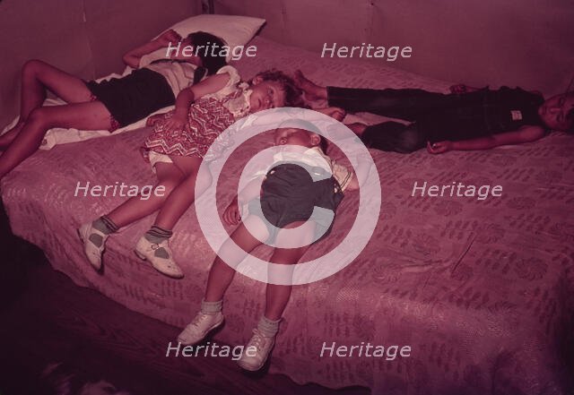 Children asleep on bed during square dance, McIntosh County, Okla., 1939 or 1940. Creator: Russell Lee.