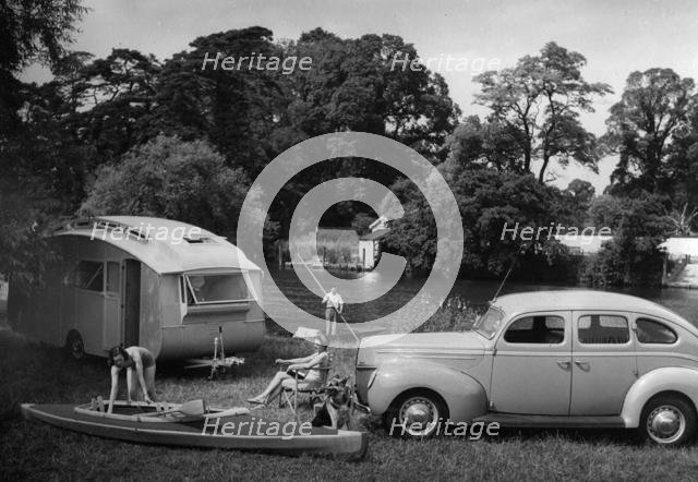 1939 Ford V8-91 with caravan. Creator: Unknown.