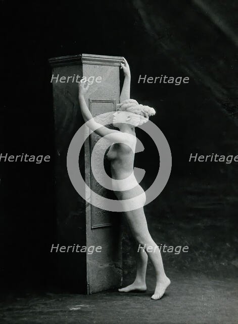 A young woman, posing naked in a classical attitude, against a square column..., c1890/1910. Creator: Unknown.