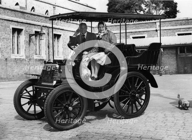 1900 Royal Daimler, with H.R.H. Queen Elizabeth with Lord Montagu in 1977. Creator: Unknown.