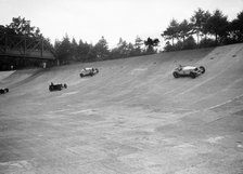 Invicta, Talbot and Frazer-Nash cars racing on the Members Banking at Brooklands. Artist: Bill Brunell.