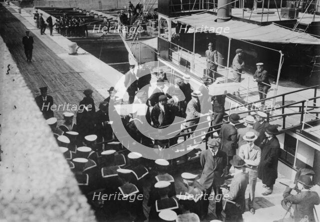 Sailors taking children in coffins from LADY GREY at Quebec, 1914. Creator: Bain News Service.