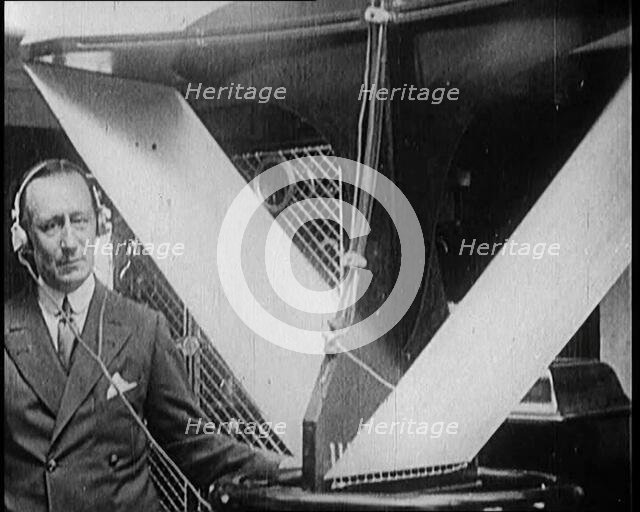 A Wireless Radio Aerial Spinning as Guglielmo Marconi Attempts to Receive a Signal, 1922. Creator: British Pathe Ltd.
