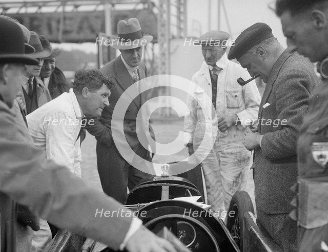 People examining Leon Cushman's Austin 7 racer at Brooklands for a speed record attempt, 1931. Artist: Bill Brunell.