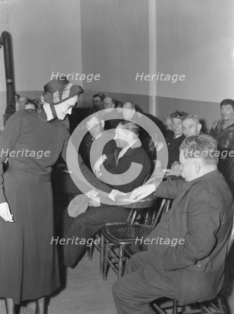 Meeting opens with taking the collection, Salvation Army, San Francisco, California, 1939. Creator: Dorothea Lange.