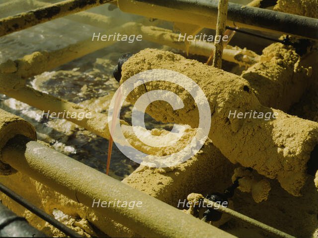 Melted sulphur from the wells pouring into relay..., Freeport Sulphur Co, Hoskins Mound, Texas, 1943 Creator: John Vachon.