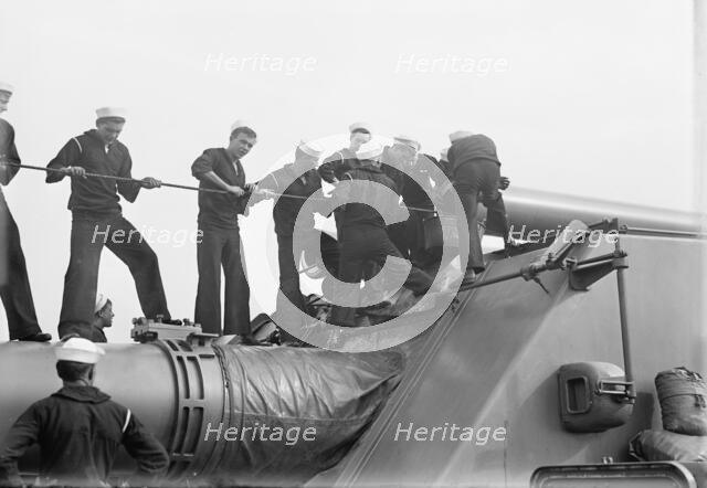Target Practice - Cleaning 12' Gun, 1913. Creator: Unknown.