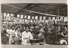 Women sat by their machines, Mackintosh Factory, Halifax, West Yorkshire, 1918. Artist: Unknown