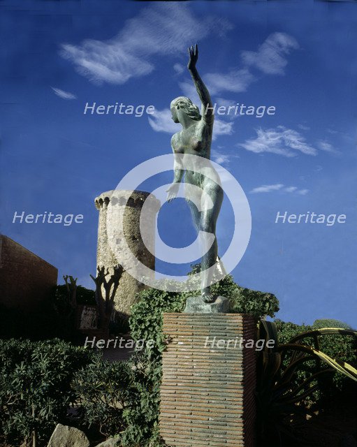 Detail of a bronze Sculpture by sculptor Enric Monjo i Garriga, in front of the house where the a…