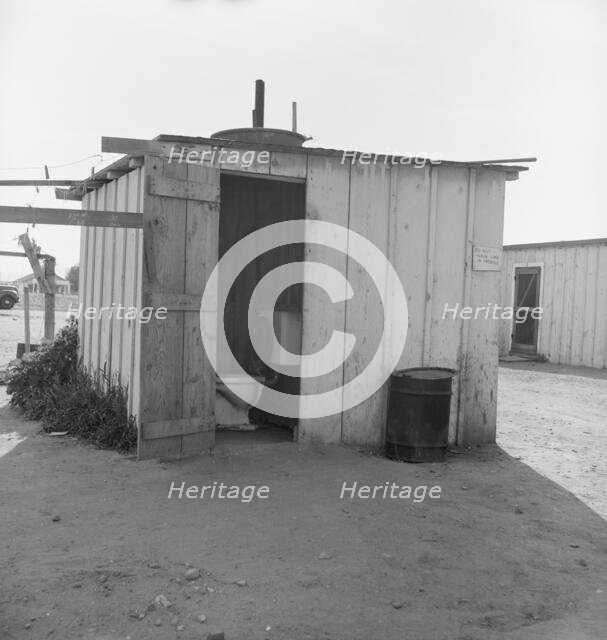 Toilet for ten cabins, men, women, and children, Arkansawyers auto camp, Greenfield, CA, 1939. Creator: Dorothea Lange.