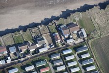 Bungalows at risk from coastal erosion, Green Lane, near Skipsea, East Riding of Yorkshire, 2014. Creator: Historic England Staff Photographer.