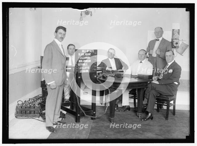 Bobroff voting machine being considered for use in house, between 1910 and 1917. Creator: Harris & Ewing.