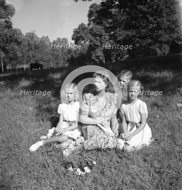 Princess Sibylla with the little princesses in Hagaparken, Stockholm, Sweden,  17/8 1944.
 Creator: Unknown.