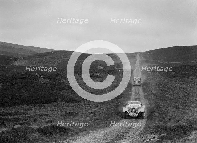 SS Jaguar 100 open 2-seater and Humber saloon competing in the RSAC Scottish Rally, 1939. Artist: Bill Brunell.