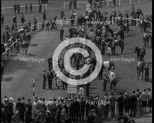 Looking Down Into One of the Enclosures at  Goodwood Race Course in Sussex with Spectators..., 1939. Creator: British Pathe Ltd.