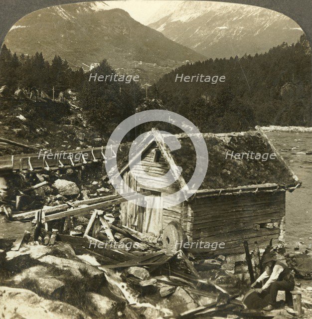 'A log-built mill and a water-wheel grindstone, on Stalheim's river, Naerodal, Norway', c1905. Creator: Unknown.