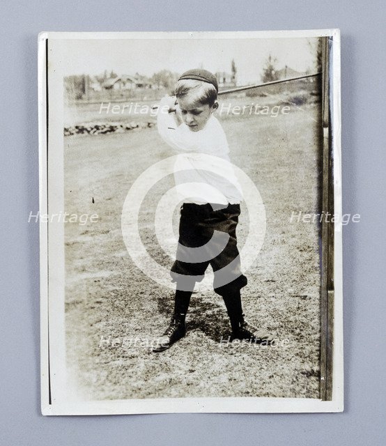 American golfer Bobby Jones playing as a young child, c1909. Artist: Unknown
