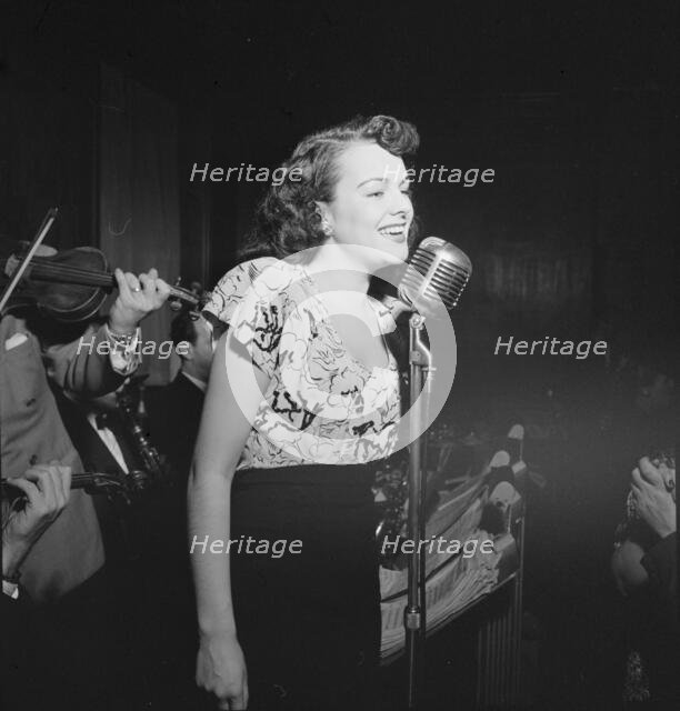 Portrait of a vocalist with Justin Stone's ensemble, 1938. Creator: William Paul Gottlieb.