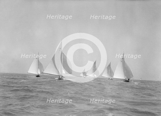 Stern view of W Class boats racing downwind, 1933. Creator: Kirk & Sons of Cowes.