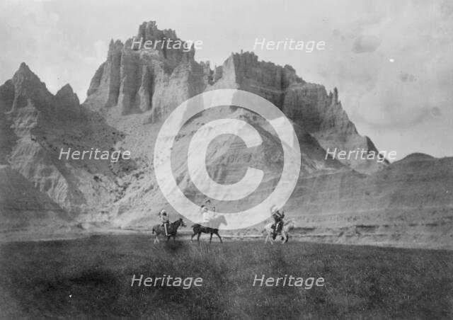 Entering the Bad Lands. Three Sioux Indians on horseback, c1905. Creator: Edward Sheriff Curtis.