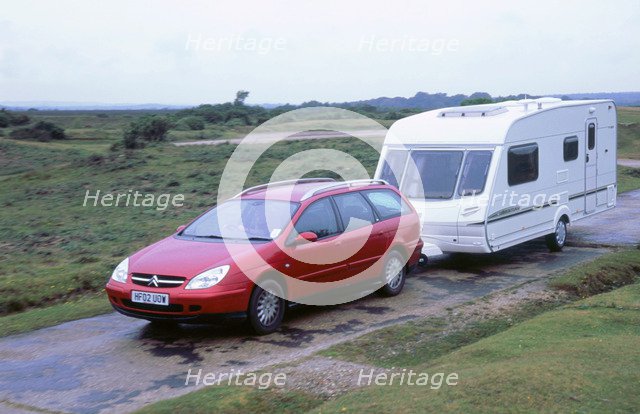 2002 Citroen C5 estate towing caravan. Artist: Unknown.