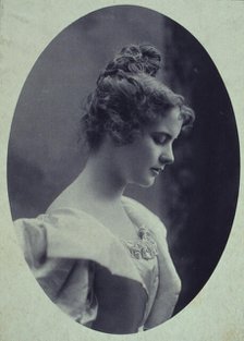 Young woman, facing right, head-and-shoulders profile portrait, c1900. Creator: Davis & Sanford.