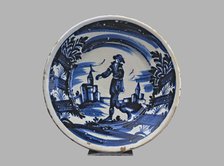 Blue plate with man and buildings, typical Catalan ceramics.