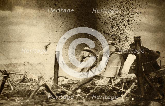 'An H.E. shell exploding', First World War, 1914-1918, (1933).  Creator: Unknown.