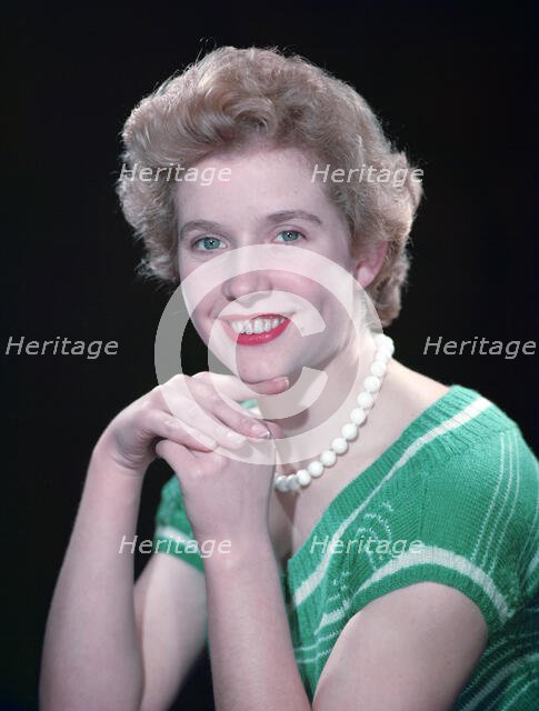 Portrait of a woman with green eyes, c1955.  Creator: Arthur Charles Kirby Ware.