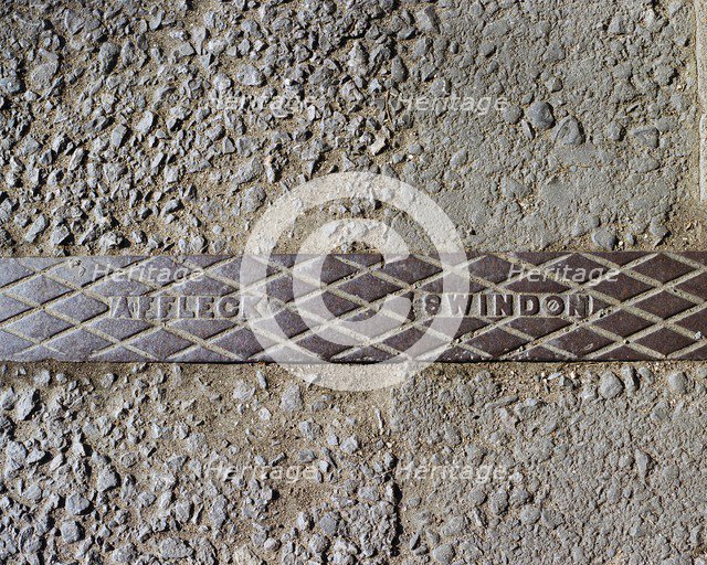 Pavement rainwater gully cover plate made by Affleck of Swindon, Swindon, Wiltshire, 2006. Artist: Peter Williams.